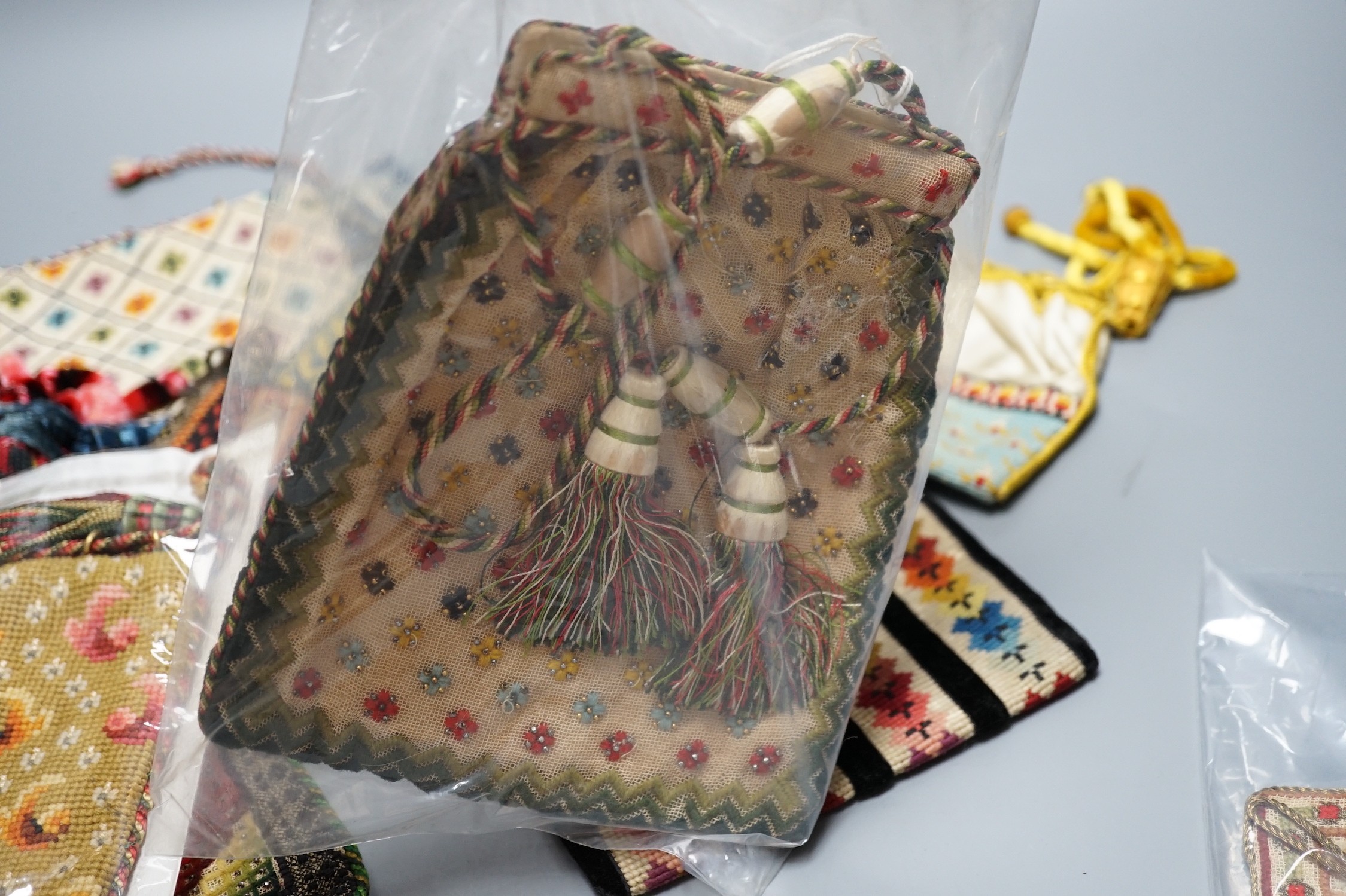 Ten 19th century embroidered and woolworked bible bags, largest 18 x 16cm